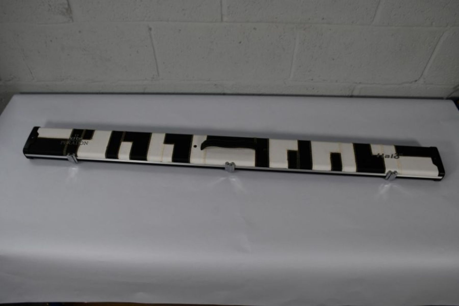 An as new Peradon 3/4 Halo Plus black and white patches cue case