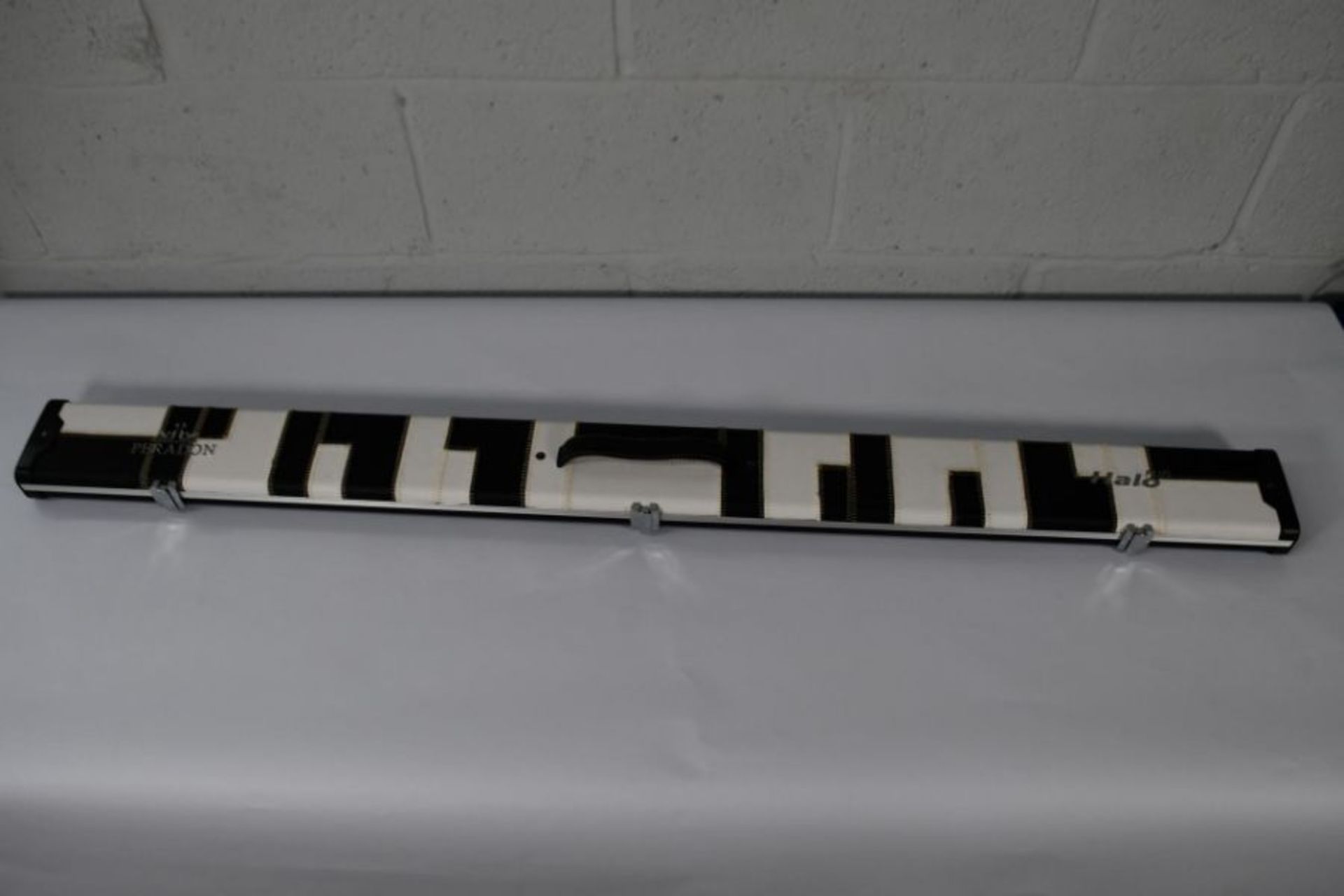 An as new Peradon 3/4 Halo Plus black and white patches cue case