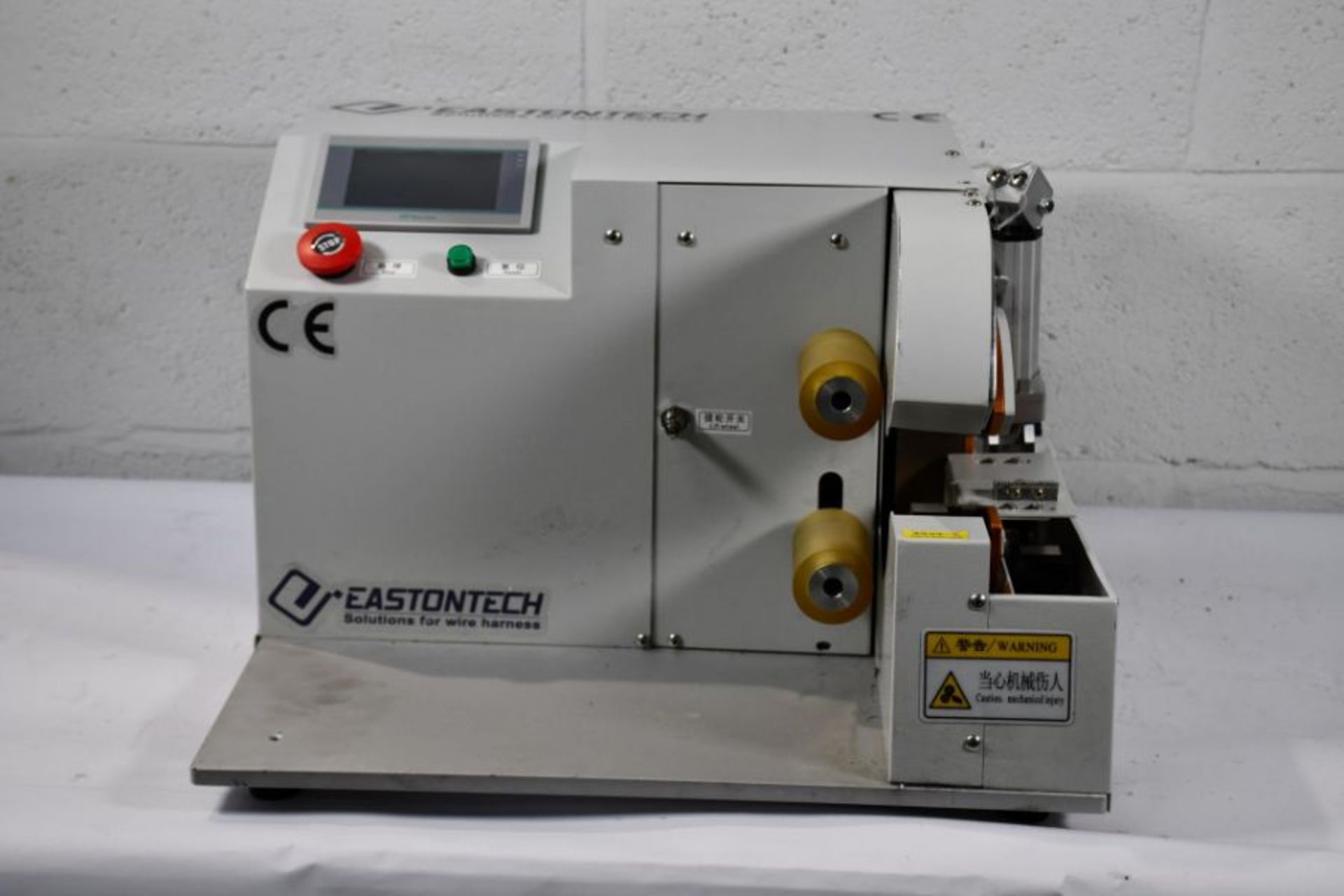 A pre-owned Eatontech EW-AT-401 automatic tape winding machine 220V