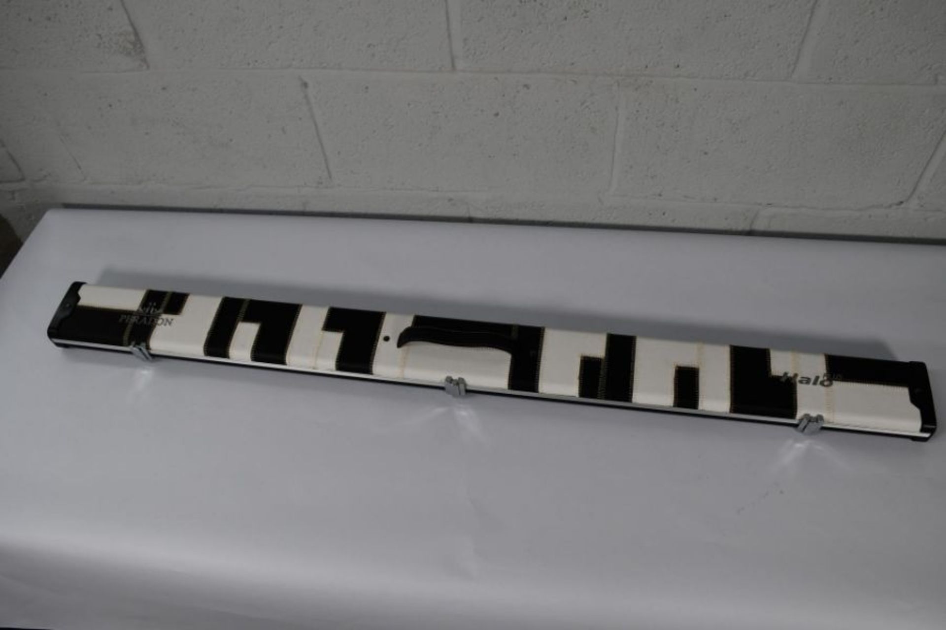 An as new Peradon 3/4 Halo Plus black and white patches cue case