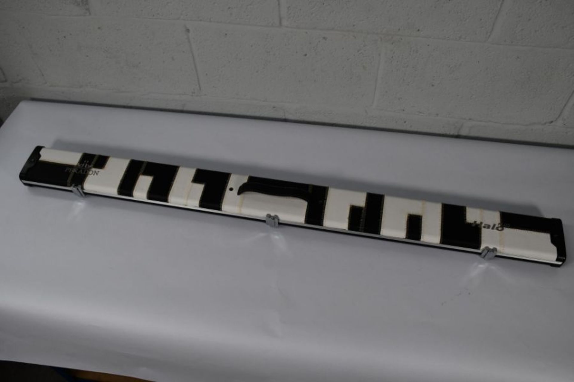 An as new Peradon Halo 3/4 plus Black and white patches cue case