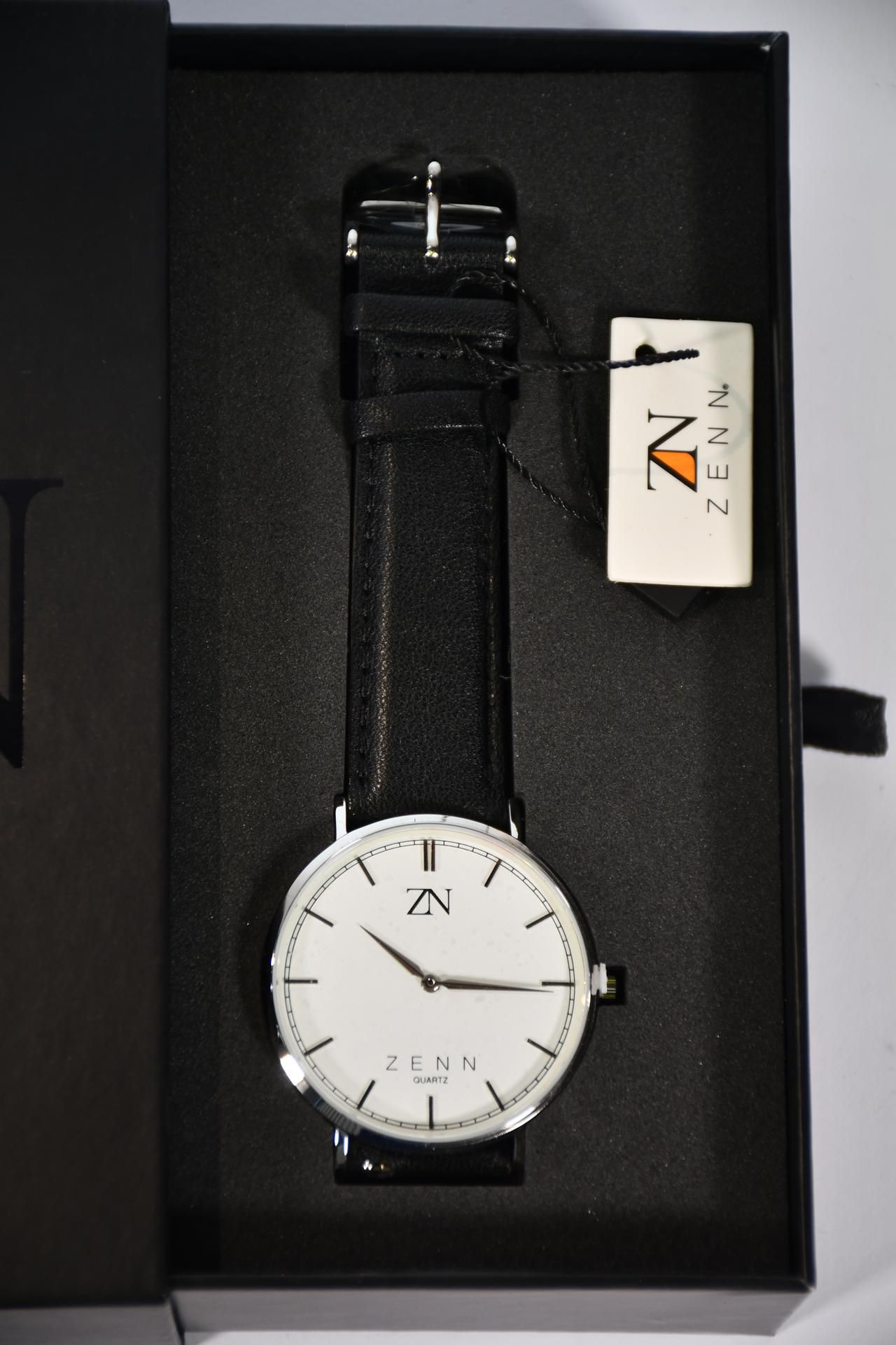 Six Zenn Classique watches with black strap and silver surround.