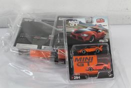 Four as new Mini GT MiJo Exclusives Pandem Toyota GR Supra V1.0 in Orange, USA Exclusive.