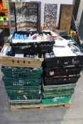 A pallet of approximately twenty four crates of assorted miscellaneous items to include homewares, h