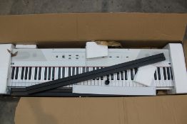 A pre-owned Alesis Recital 88 key Digital piano with stand - white (Viewing recommended).