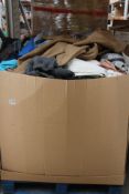 A pallet of pre - owned clothing and related items.