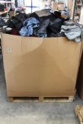 A pallet of pre-owned clothing and related items.