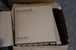 Nine boxed Bucanim smart scales.