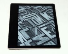 A pre-owned Amazon Kindle Oasis 10th Gen (Wi-Fi, 32GB) 7" E-Reader in Gold (Grade B).