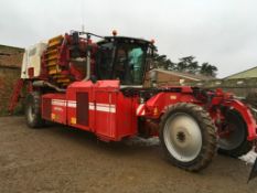 2010 Grimme Varitron 220 self propelled twin row potato harvester with KS72 front mounted topper. Se