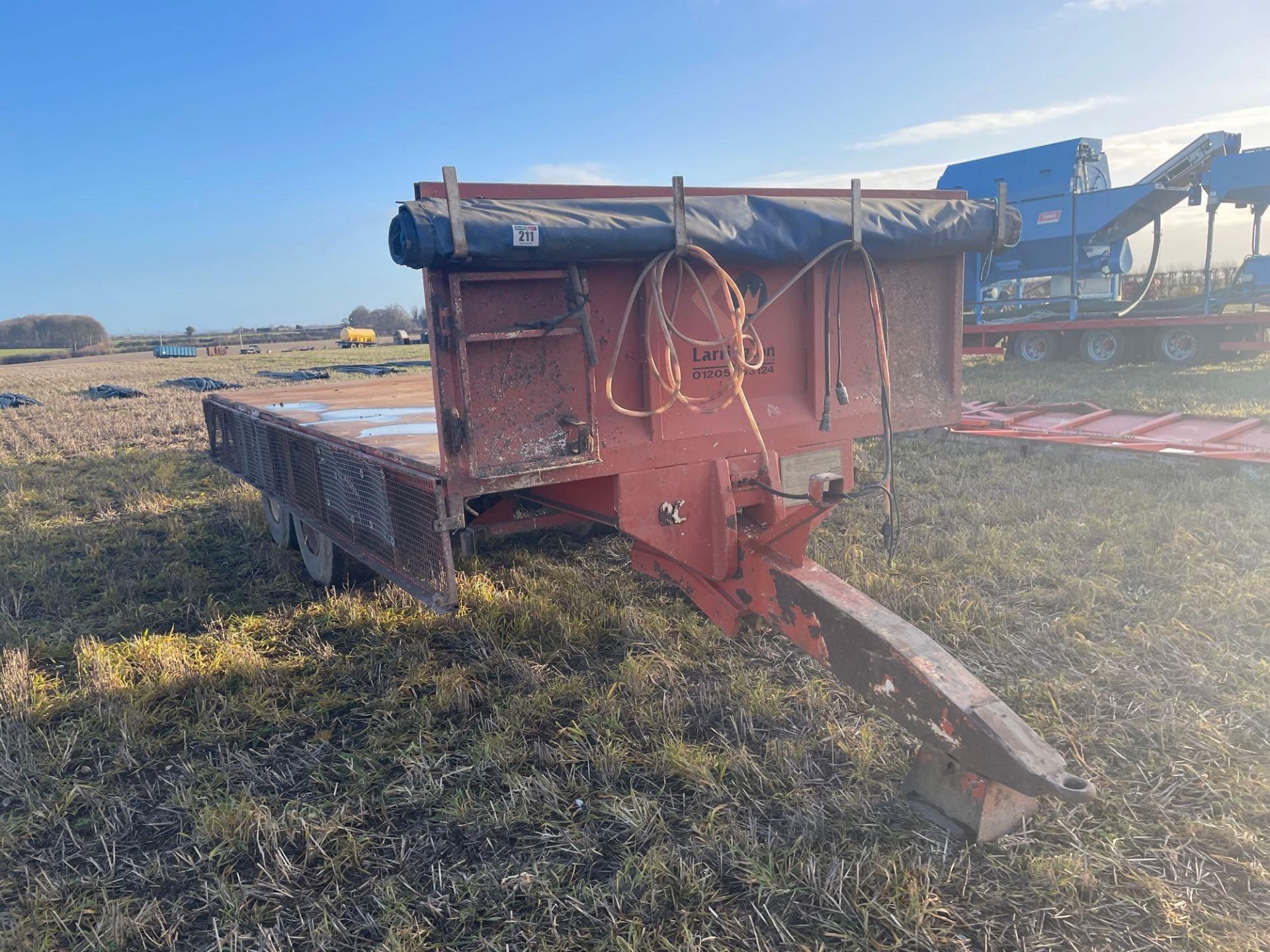 1995 Richard Larrington twin axle flatbed trailer with commercial axle, hydraulic brakes, sprung dra