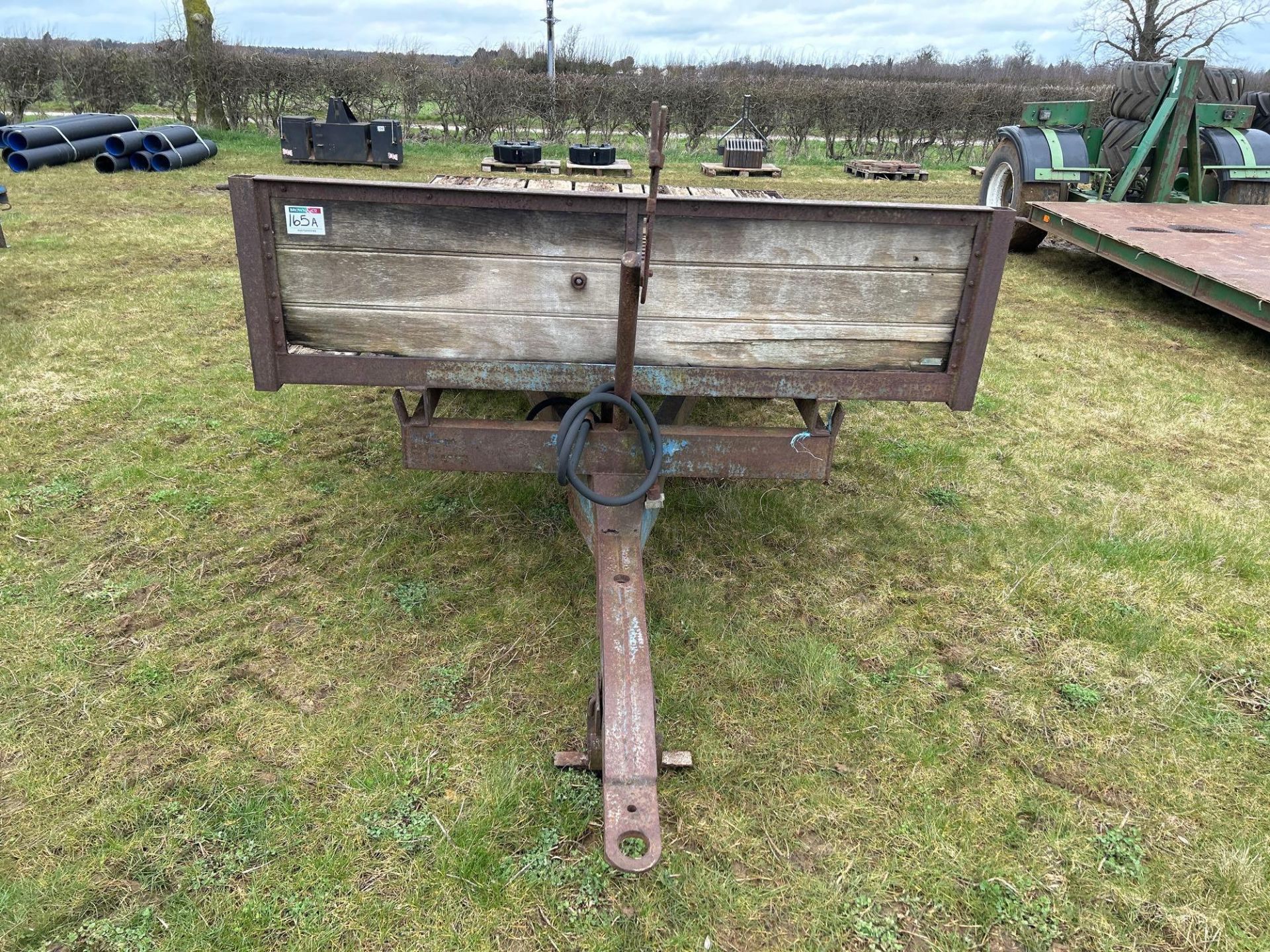 Single axle flat bed trailer with wooden floor