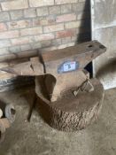 Anvil on wooden block