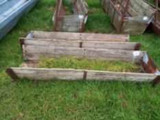 Quantity of wooden feed troughs