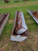 Quantity of metal feed troughs