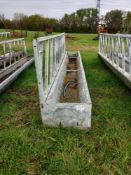 Cattle feed barrier with trough