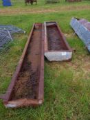 Quantity of metal feed troughs