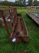 Cattle feed barrier with trough