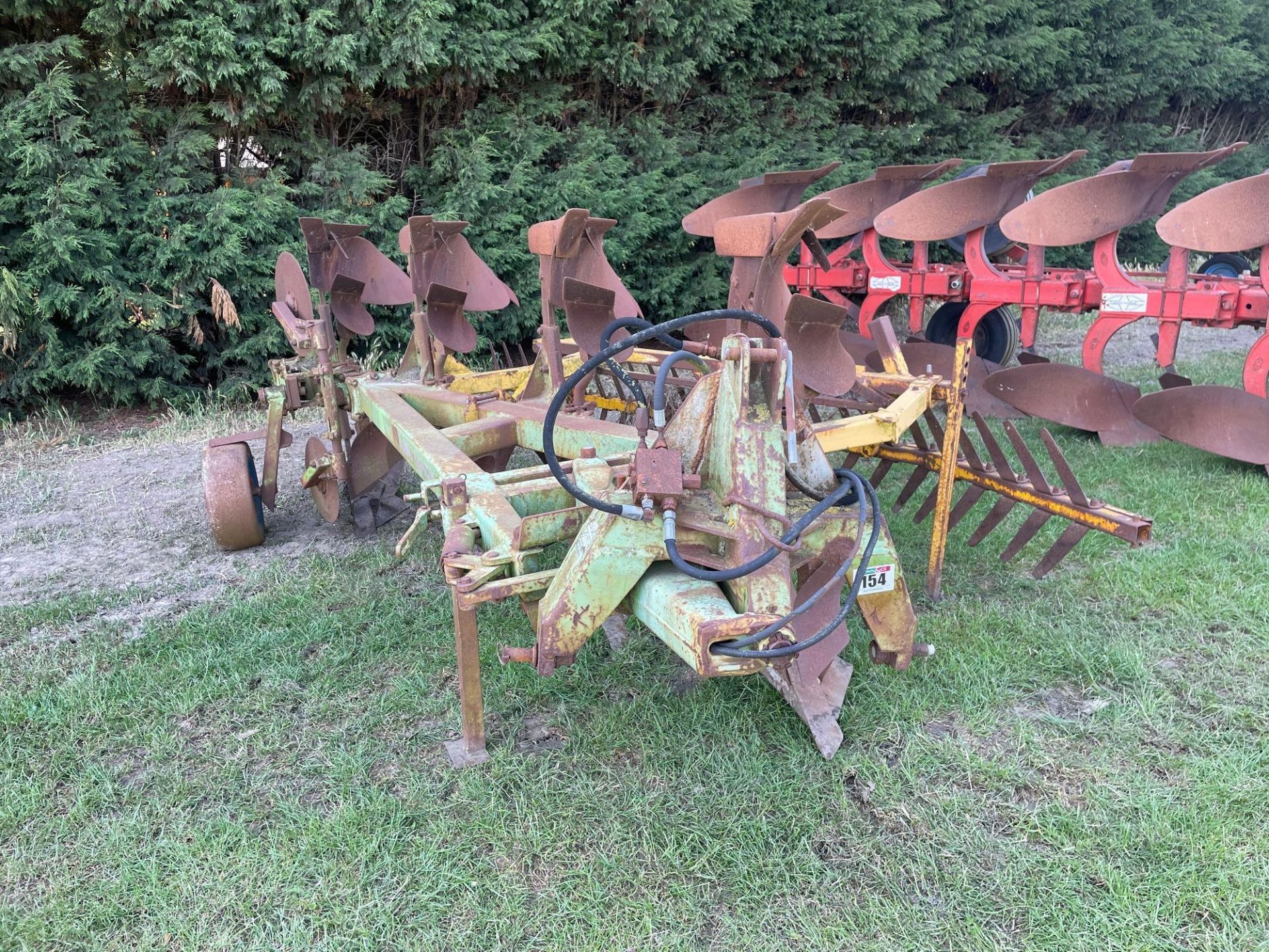 Dowdeswell DP8 4f reversible plough with Claydon furrow cracker. Serial No: 214751668