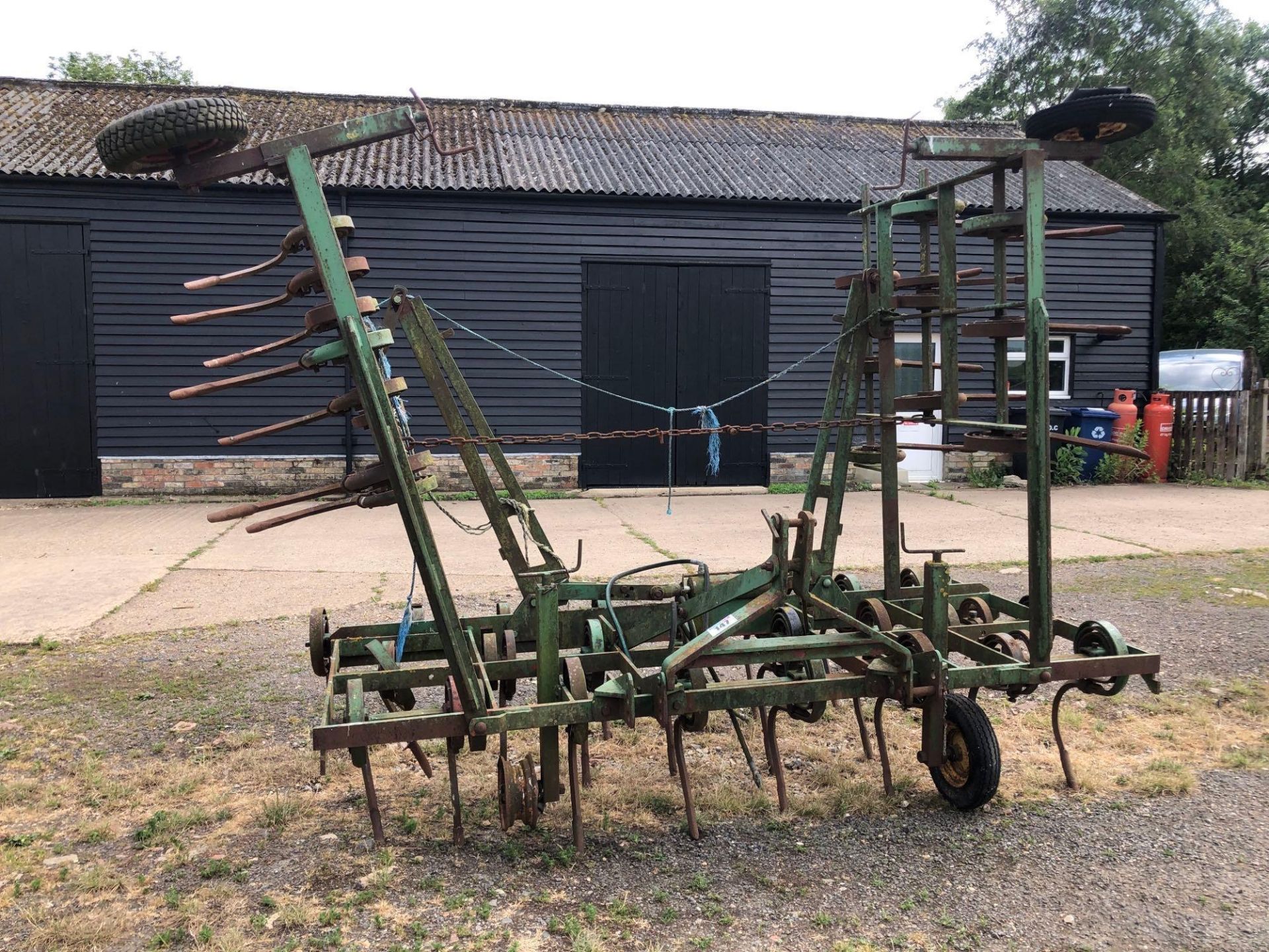 Massey Ferguson 39 16ft hydraulic folding springtine cultivator with depth wheels, linkage mounted.