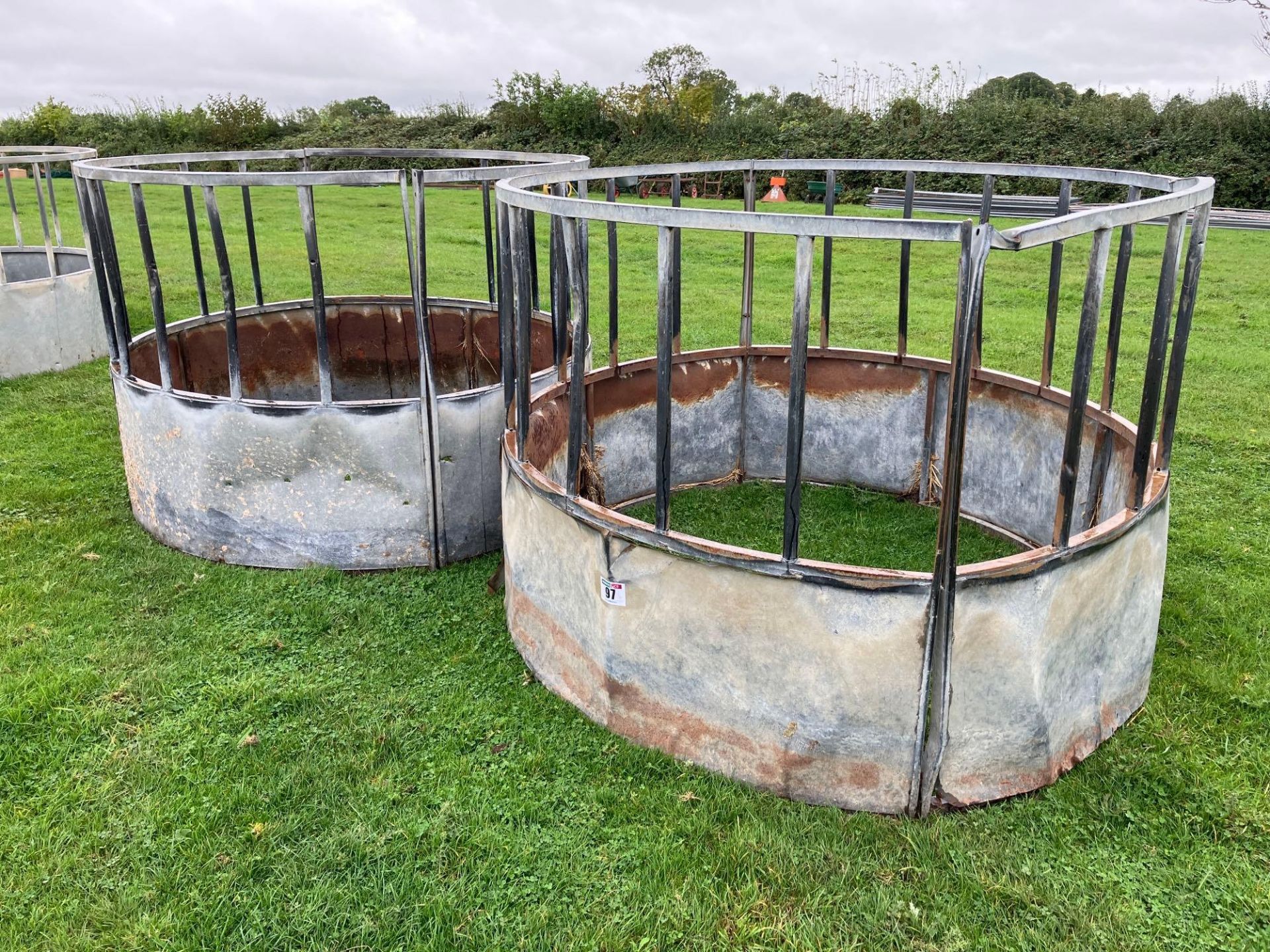 2No galvanised cattle ring feeders