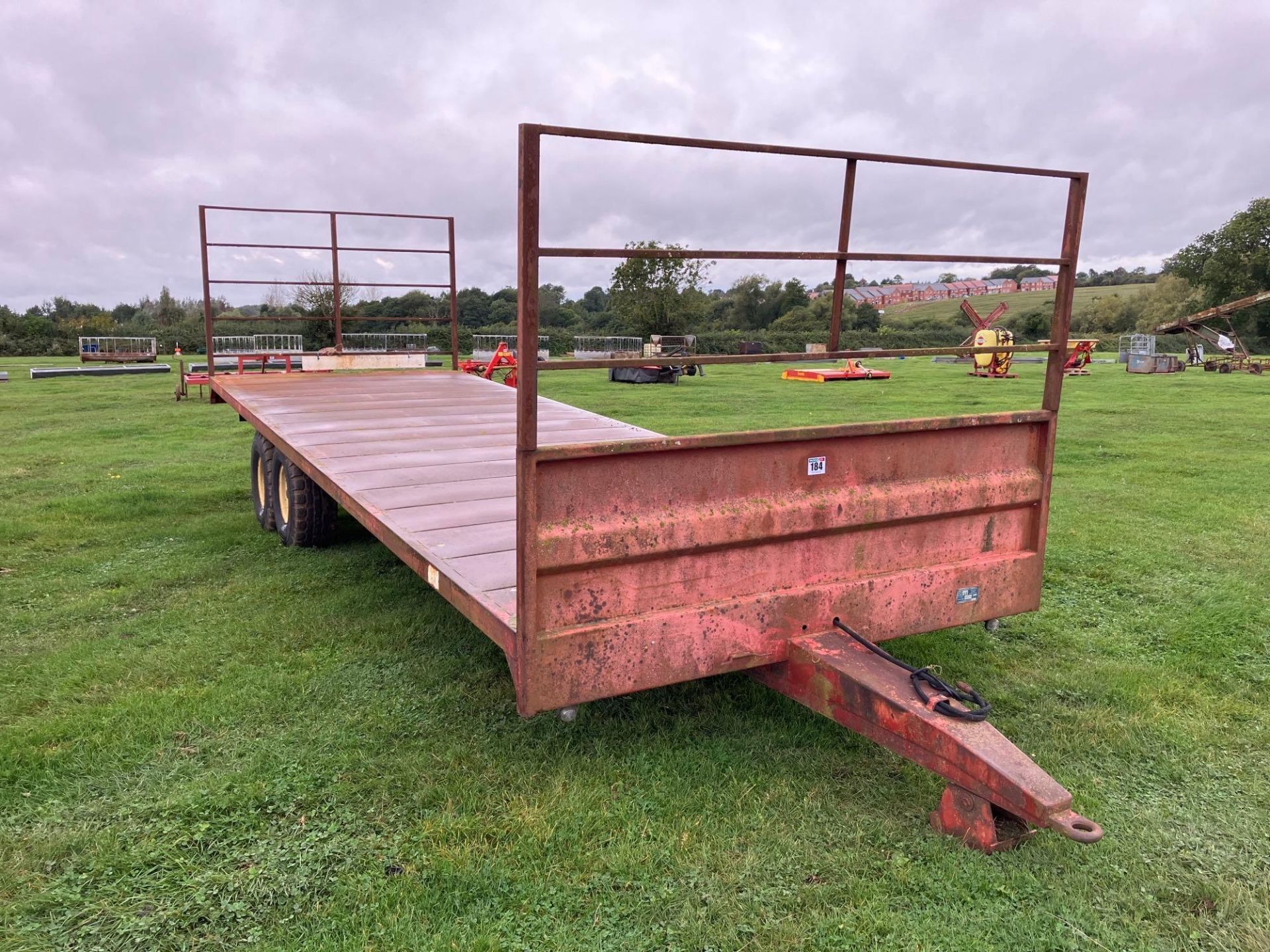 1989 Marshall BC25 bale trailer with metal floor, front and rear raves, twin axle on 12.5/80-15.3 wh