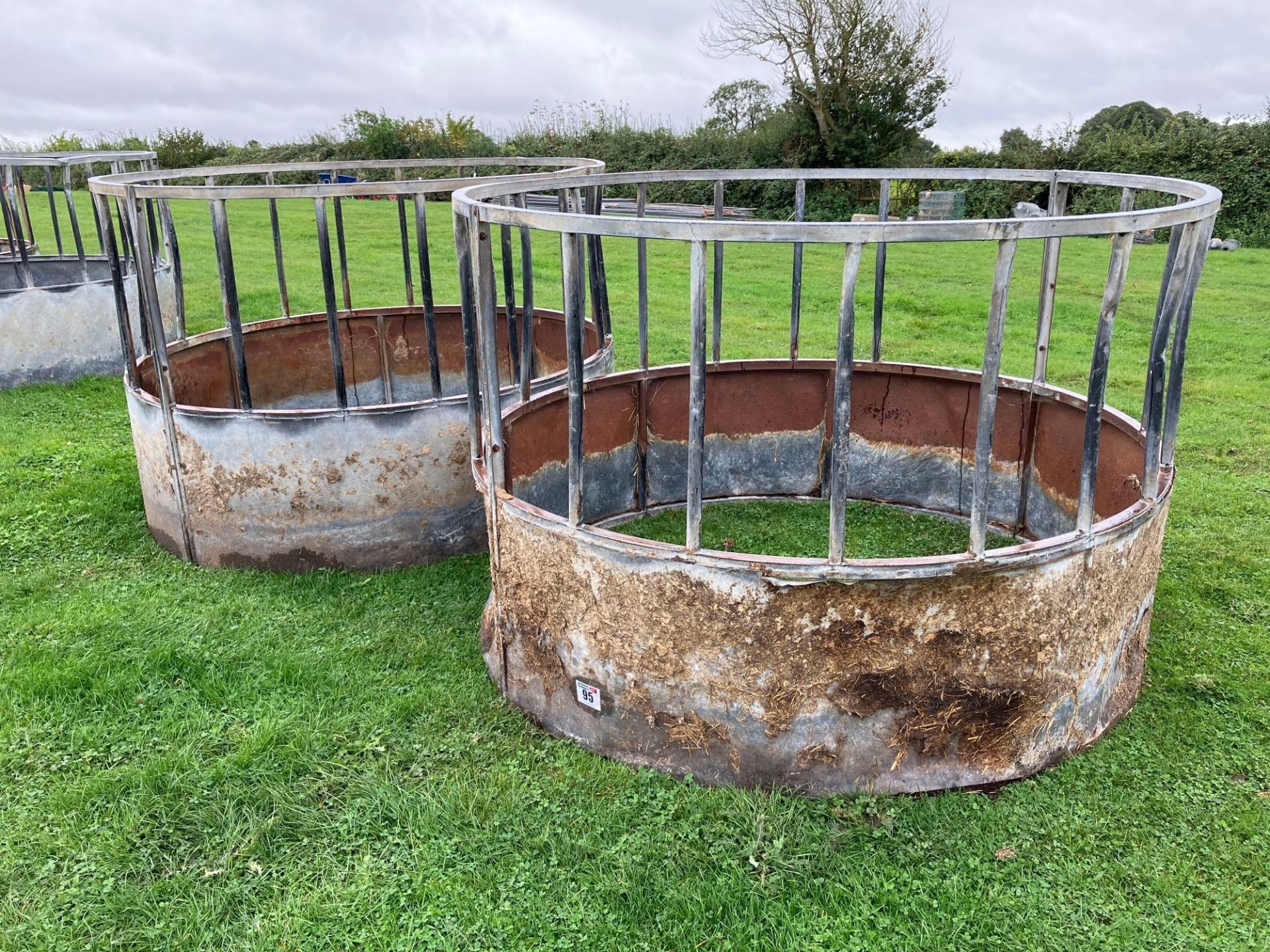 2No galvanised cattle ring feeders