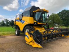 2012 New Holland CX5090 combine harvester with 20ft Varifeed header on Goodyear 800/65R32 front and