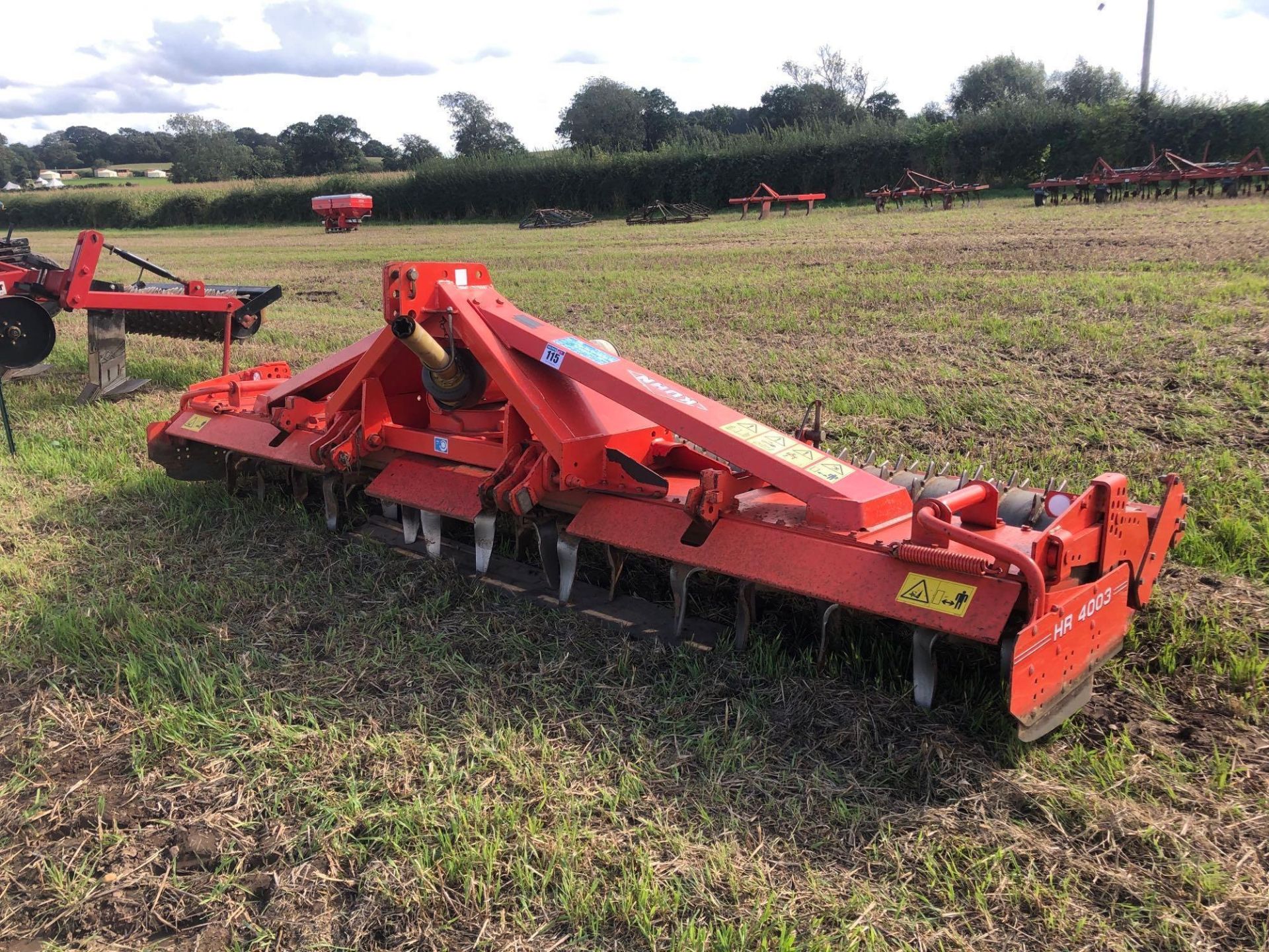 2001 Kuhn HR4003D power harrow with rear maxi packer, quick release tines, linkage mounted. Serial N