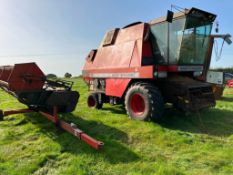 1986 Massey Ferguson 29 combine harvester with 14ft header and trolley on 23.1/26 front and 12.5/80-