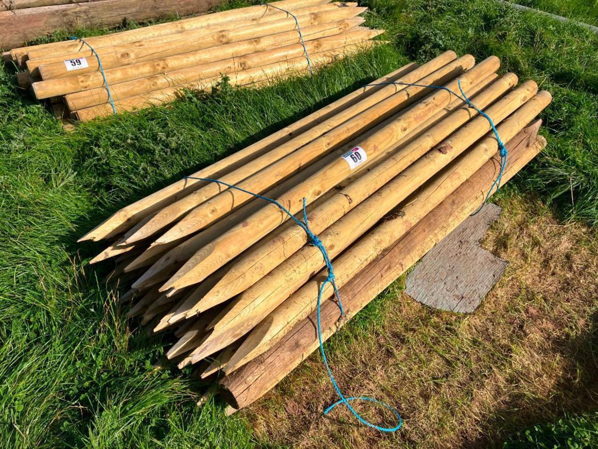 Quantity 3" round timber fence posts