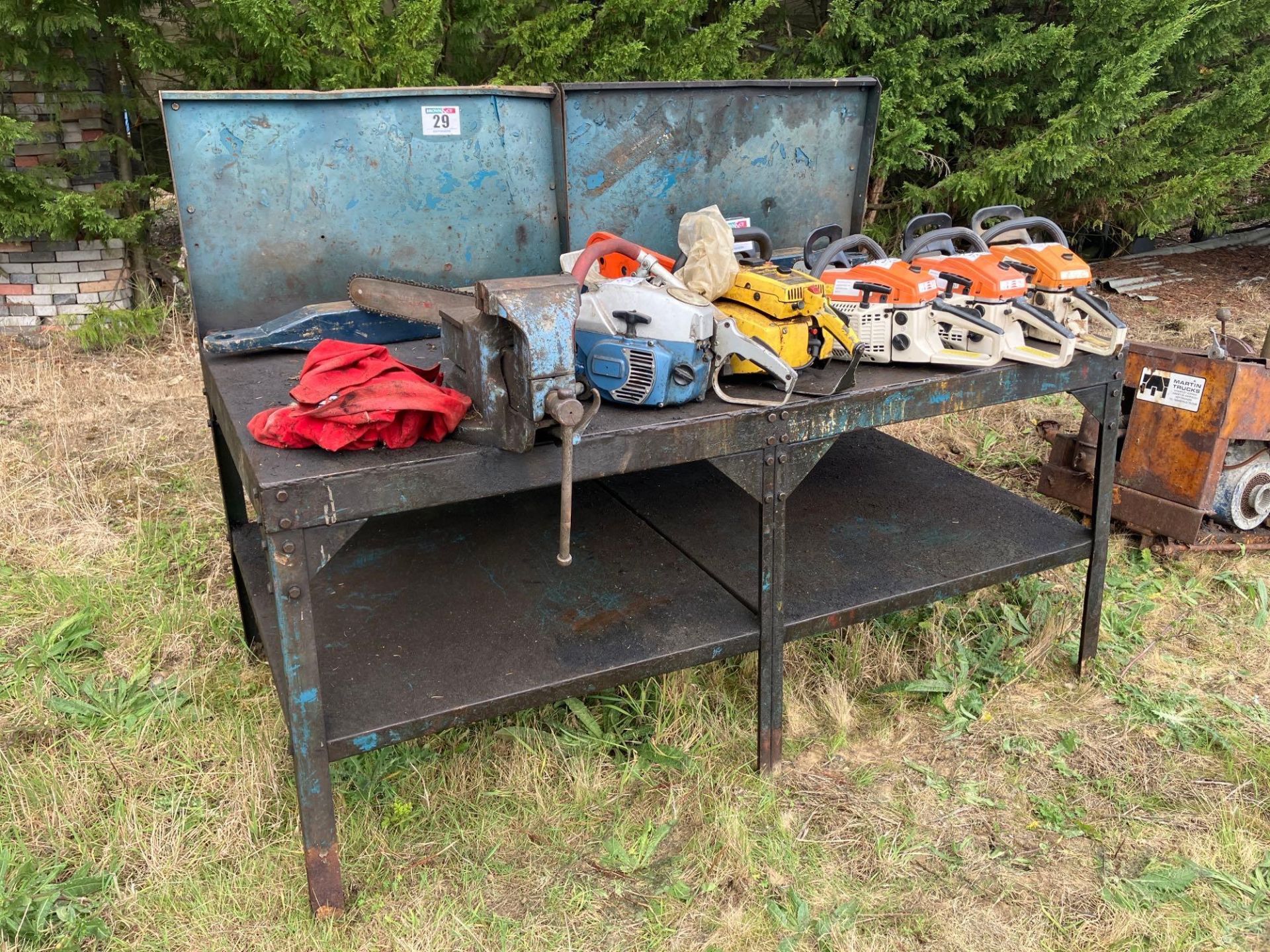 Metal workshop bench with vice (chainsaws not included)