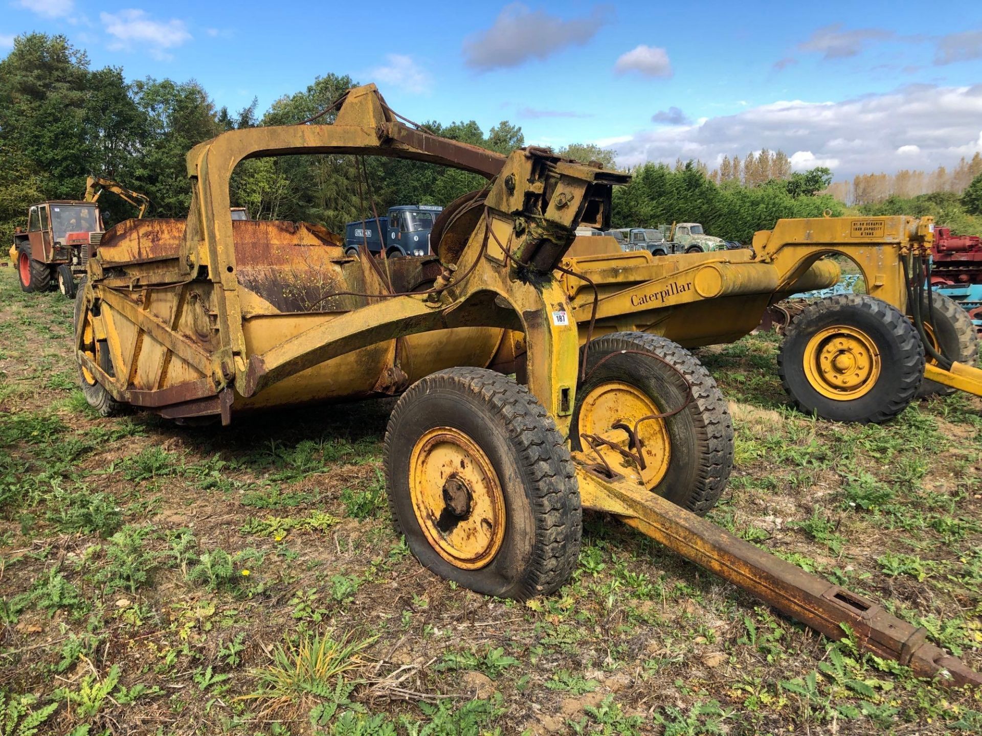 Trailed cable operated scraper