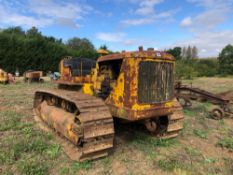 Caterpillar D7 metal tracked crawler with 22" tracks, rear swinging drawbar and rear cable winch