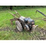 Trusty Tractor self propelled garden tool with JAP engine, tool bar and various attachments. Serial