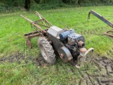 Trusty Tractor self propelled garden tool with JAP engine, tool bar and various attachments. Serial