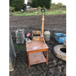 Wooden table, chain saw sharpener and light