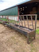 Feed barriers with troughs