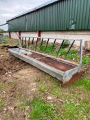 Feed barriers with troughs