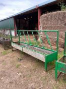 Feed barriers with troughs