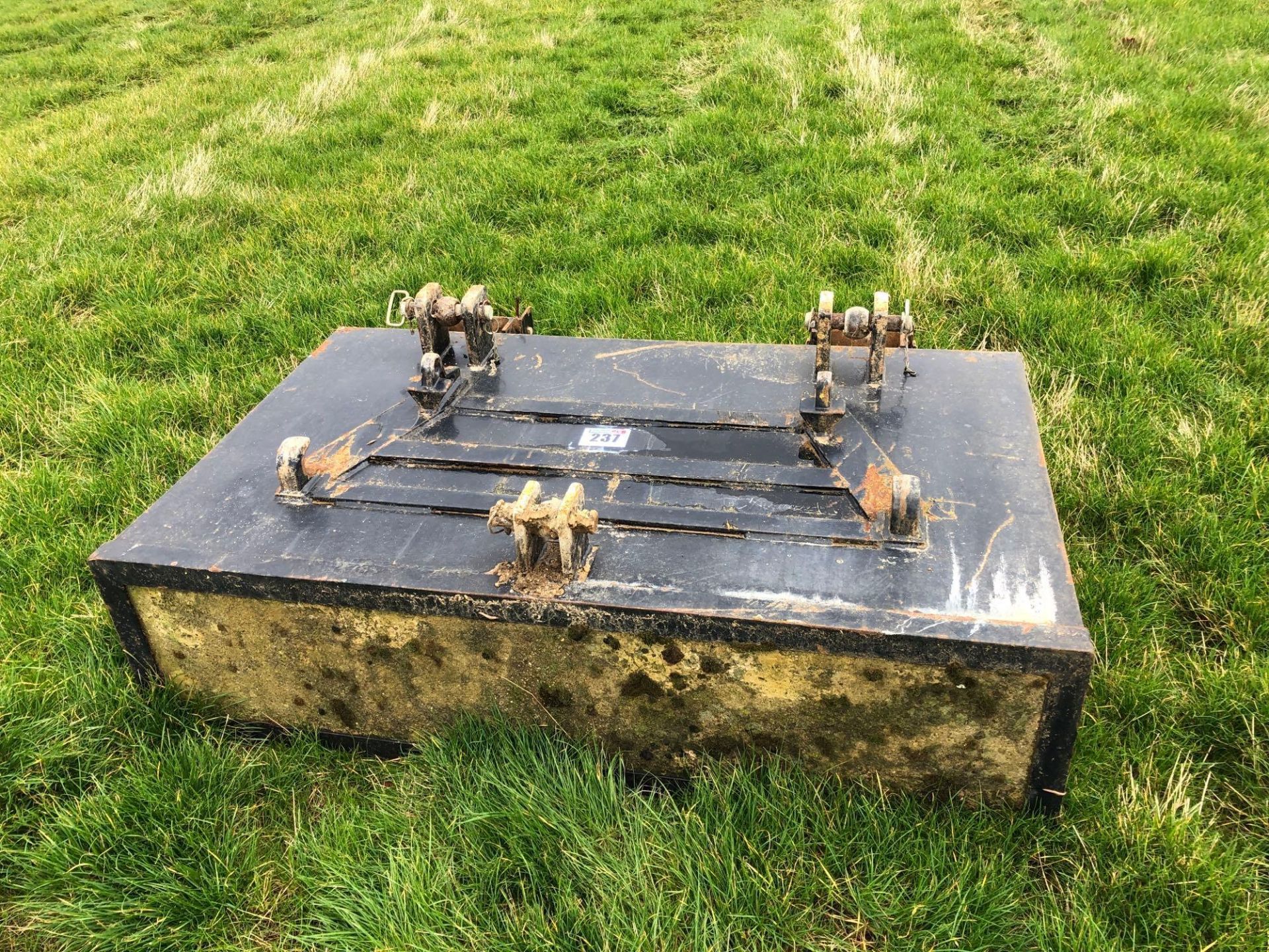 Ballast block with linkage mounted and loader bracket attachments