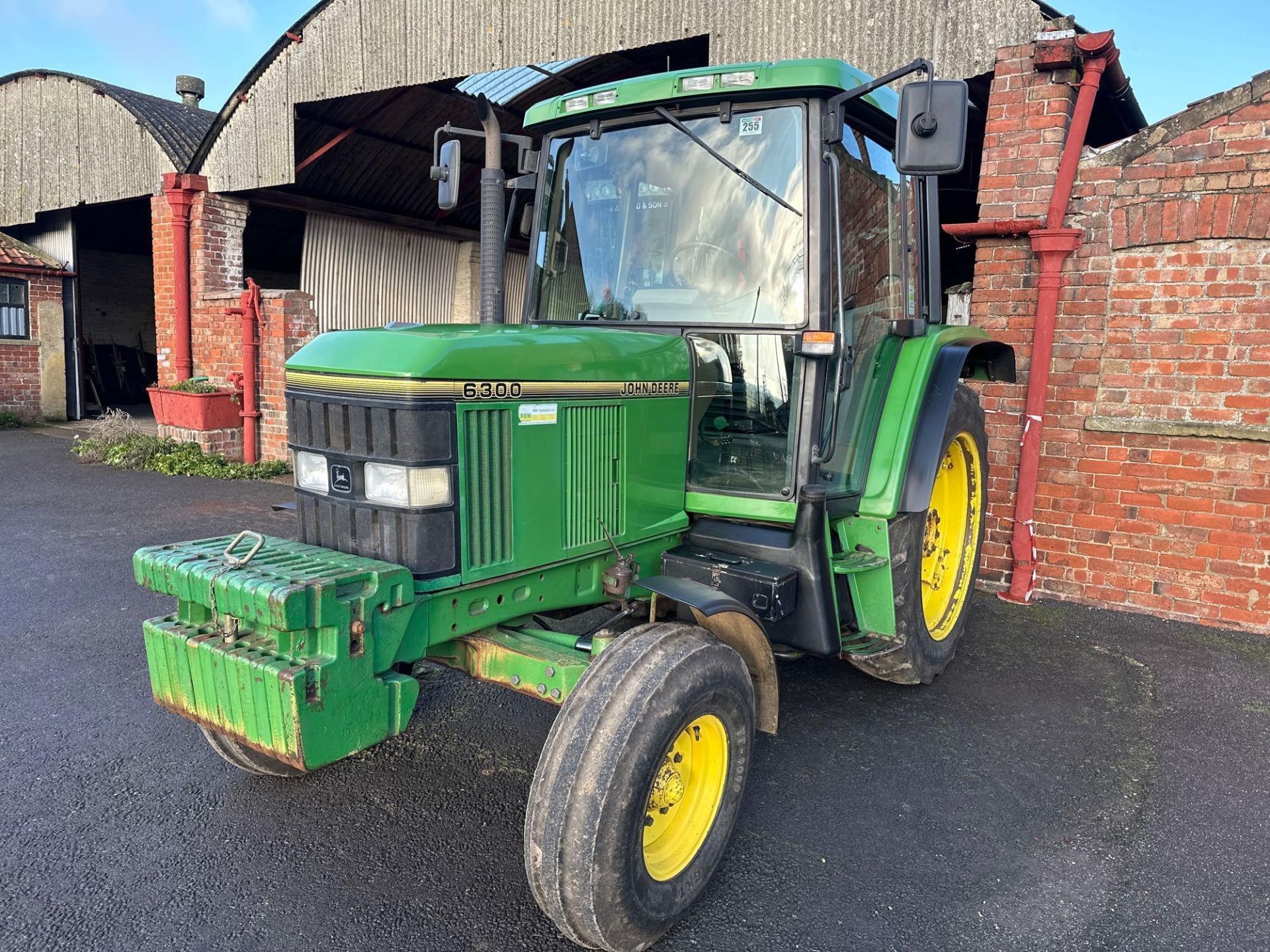 1993 John Deere 6300 Power Quad tractor on 10.0-16 front and 13.6r38 rear wheels and tyres. On farm