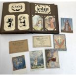 A postcard album containing over 350 postcards including approx 130 by Margaret Tarrant, subjects