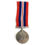 A World War II service medal, possibly issued to D Beresford