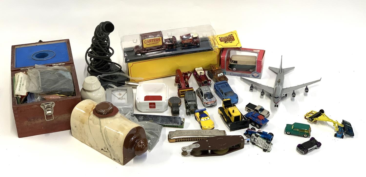 A mixed lot to include die cast and other vehicles, stoneware hot water bottle, Tremola harmonica,