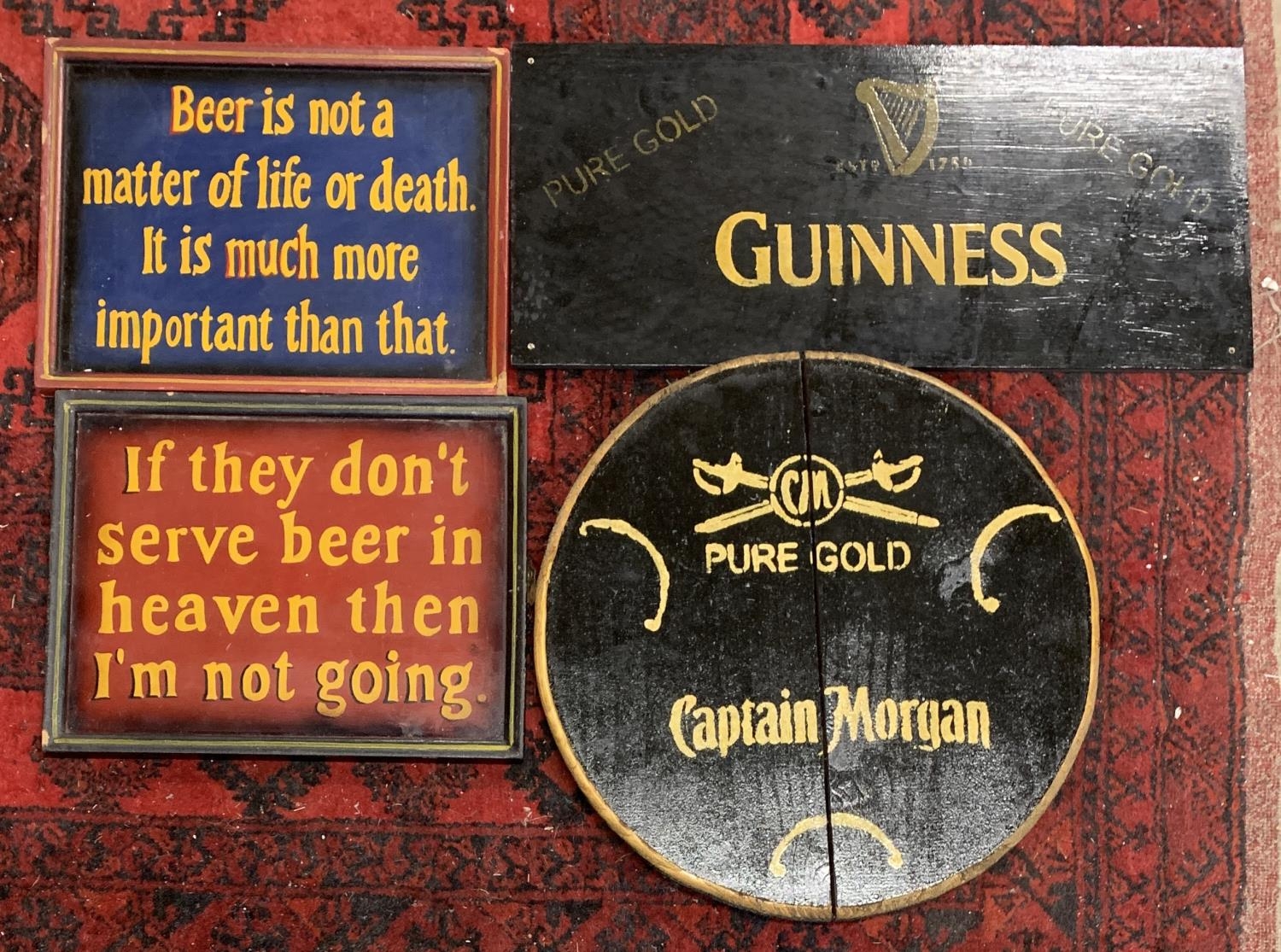 Brewery interest: Four hand painted wooden alcohol signs to include Guinness, 58cmW