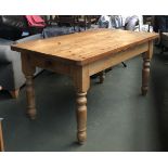 A pine kitchen table, with end drawer, 153x86x78cmH