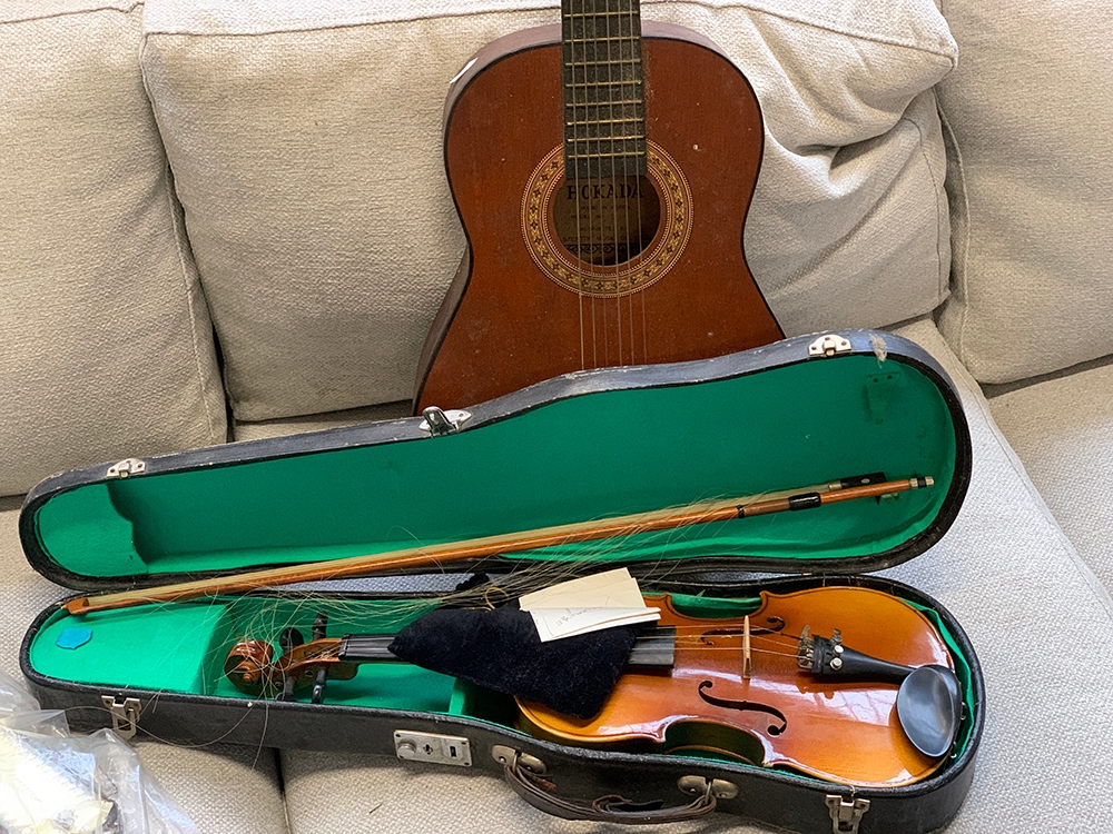 A Chinese student violin in case; together with a Hokada guitar