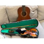 A Chinese student violin in case; together with a Hokada guitar