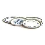 Four German oval ceramics trays with plated pierced galleries, the largest 53cmL, one stamped WMF